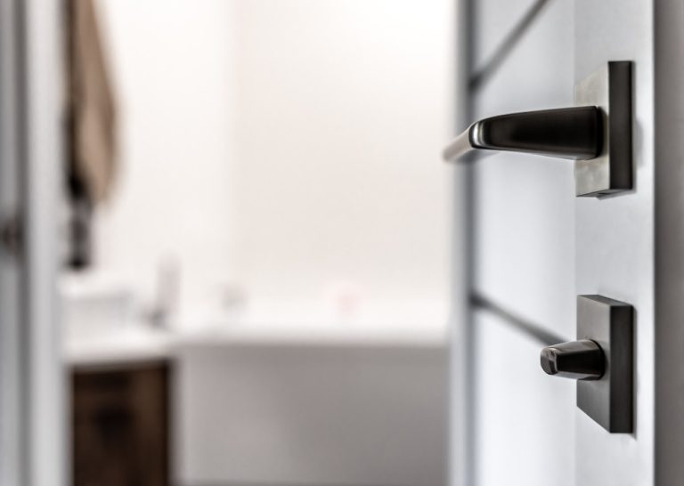 close-up-metal-doorknob-blurred-background-home-interior
